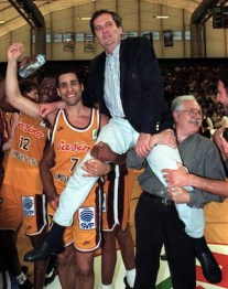 Limoges basketball team captain Richard Dacoury (L) lifts trainer Maljkovic , May 14th..