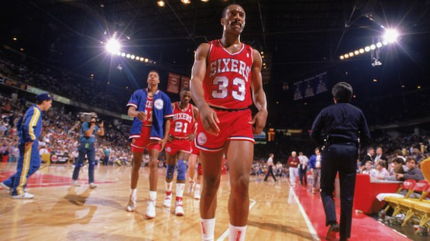 Hersey Hawkins walks off the court